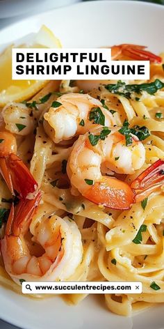 a white plate topped with pasta and shrimp