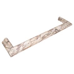 a marble shelf with two handles on each side and one end in the shape of an arrow