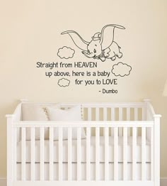 a baby's room with a crib and wall decal that says, straight from heaven up above here is a baby for you to love dumbo