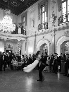 a man and woman dance in front of an audience