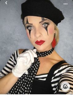 a woman with makeup on her face wearing a black hat and polka dot scarf over her shoulder