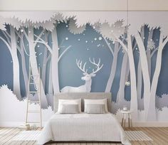 a bedroom with blue walls and white deer in the woods wallpaper mural decal