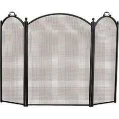 an iron fireplace screen with three panels on the sides and one panel open to show it's design