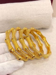 Christmas Gift, Holiday Gift,  24k gold plated Bangles, Indian Bridal Bangles, Handmade Bracelet for Women Gold Bangles for Women - Indian Bridal Bangles - Handmade Bracelet These stylish bangles feature a classic bangle design and are available in gold color. ▶ BEAUTIFUL HINGED GOLD BRACELET ▶ HIGED TO OPEN WIDE----- STAYS SECURELY SHUT ----- LIFT TAB SIDE TO OPEN Material: High quality 24k gold plated bangles ( Not solid gold) Diameter: 2.36 inches Can open Lead & Nickel free Tarnish resistant Women Gold Bangles, Indian Bridal Bangles, Classic Bangles, Gold Bangles For Women, Gold Plated Bangles, Gold Armband, Bangles Indian, The Bangles, Bridal Bangles