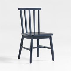 a blue wooden chair sitting on top of a white floor