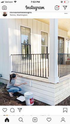 a woman painting the outside of a house