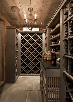 a wine cellar with lots of bottles in it