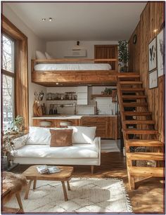 a living room filled with furniture next to a stair case and wooden steps leading up to a loft bed