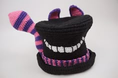 a crocheted hat with teeth on it