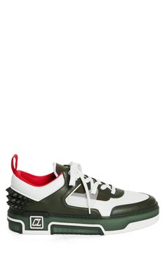 A '90s-inspired street-savvy silhouette that borrows from basketball and skate shoes of the era defines this mixed-media sneaker bristled with signature spikes. Lace-up style Removable insole Leather and textile upper/textile lining/synthetic sole Imported Designer Shoes Sporty Spiked Leather Sneakers, Sporty Low-top Basketball Shoes With Studded Outsoles, Casual Custom Sneakers With Spikes For Streetwear, Sporty Custom Sneakers With Spikes For Streetwear, Sporty Basketball Shoes With Studded Rubber Outsoles, White Low-top Sneakers With Spikes, Sporty High-top Sneakers With Spikes And Round Toe, Sporty High-top Sneakers With Spikes, Casual White Sneakers With Spikes