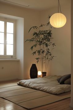 a room with a bamboo plant in the corner