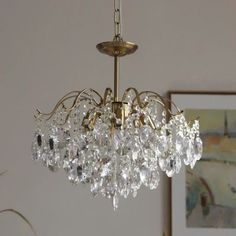 a chandelier hanging from the ceiling in a room