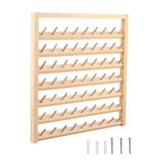 a wooden wine rack with two screws on the bottom and four pegs in front