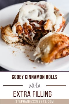 a close up of food on a plate with the words gooey cinnamon rolls with extra filling