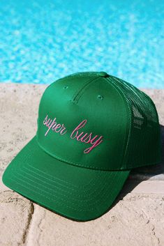 We are loving this "super busy" 5-panel kelly green mid profile mesh back trucker hat, boldly embroidered in pink thread *NOT A FOAM TRUCKER* Mesh Back -Adjustable snap back -One size fits most Cheap Green Flat Brim Snapback Hat, Green Trucker Snapback Hat With Curved Bill, Green Trucker Hat Snapback Style, Green Snapback Trucker Hat, Green Fun Snapback Trucker Hat, Green Snapback Trucker Hat, Fun Style, Fun Green Snapback Trucker Hat, Adjustable Green 5-panel Trucker Hat, Fun Green Trucker Baseball Cap