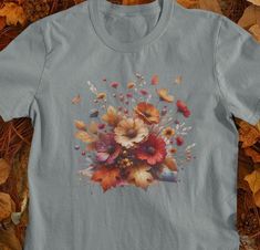 Embrace the beauty of fall with our Boho Cottagecore Fall Flowers T-Shirt. This tee features a stunning bouquet of autumn blooms, perfect for those who adore the cozy, earthy tones of the season.  Crafted from high-quality, 100% cotton, this pressed flower shirt offers soft-washed, garment-dyed fabric for unmatched comfort. Its relaxed fit and durable construction make it ideal for both casual and semi-formal settings. Whether you're layering up for a crisp autumn day or gifting it to a gardenin Multicolor Floral Print T-shirt For Fall, Fall Plants Print Cotton T-shirt, Fall Cotton T-shirt With Floral Print, Fall Cotton T-shirt With Plants Print, Fall Crew Neck T-shirt With Plants Print, Fall Floral Print T-shirt, Botanical Crew Neck T-shirt For Fall, Cottagecore Fall, Aesthetic Tshirt