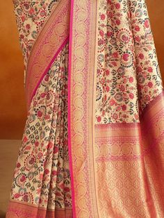 Introducing our outstanding beige kalamkari printed banarasi silk saree with blouse! Made with high-quality banarasi silk material, this saree exudes elegance and sophistication. The beige color adds a touch of grace, while the kalamkari printed work creates a mesmerizing ensemble. The rich pallu with zari weaving border enhances the overall look, making it a perfect choice for weddings, festivals, and other special occasions.
The accompanying pink color banarasi silk fabric blouse complements t Cream Saree For Navratri Festival, Bollywood Style Beige Saree Blouse Piece, Cream Art Silk Blouse Piece For Festivals, Cream Saree With Pallu For Navratri, Unstitched Beige Bollywood Saree, Bollywood Beige Blouse With Pallu, Bollywood Style Beige Blouse With Pallu, Beige Traditional Wear With Pallu For Festivals, Beige Silk Saree For Diwali