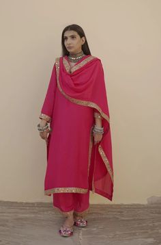 This is a 3-piece set. The set consists of lace detailing kurta has round neck; 3/4th sleeves & calf length teamed with matching pants and a doriya dupatta. The set is a loose style garment. 3-piece set Fabric-Muslin Kurta Length-40 inches Bottom Length- 38 inches. Dupatta Fabric - Doriya Work-Lace Detailing Color-Pink Sleeves - 3/4th Sleeves Neck-Round Neck Washing Care-Cold Wash Only Traditional Pant Set With Sheer Dupatta For Diwali, Traditional Pant Set With Sheer Dupatta, Traditional Pant Set With Sheer Dupatta For Eid, Festive Pant Set With Sheer Dupatta And Straight Kurta, Celebration Set With Sheer Dupatta And Long Sleeves, Celebration Sets With Sheer Dupatta, Elegant Festive Set With 3/4 Sleeve, Elegant Festive Sets With 3/4 Sleeve, Elegant Holiday Set With 3/4 Sleeves