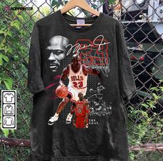 Step onto the court in style with our Michael Jordan T-Shirt. This iconic shirt pays homage to the legendary basketball player, featuring his signature logo and a retro American basketball design. Made with premium quality fabric, it guarantees comfort and durability. Whether you’re shooting hoops or simply showing off your love for the game, this unisex shirt is a perfect fit for any basketball enthusiast. With its timeless design and superior craftsmanship, it offers unmatched value, mak Jordan Tshirt, Jordan Sweatshirt, Jordan Tees, Basketball Tees, Jordan Shirts, Graphic Style, Michael Jordan, Jordan Retro, Unisex Shirt