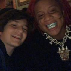 two people with braces are smiling for the camera