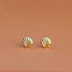 "Tiny 14k Solid Gold Minimalist Seashell Stud Earrings, Dainty and Unique 14k Yellow or White Solid Gold Nautical Earrings for Women. A pair of unique and minimalist stud earrings that will look great with any outfit you'll wear and add BLING to your look. They are light and comfortable to wear, perfect as second or third-hole earrings, and add a minimalist statement to anything you'll wear. A must-have earrings for any style! Material: ♦ 14K Yellow / White Gold Please choose from the drop-down Shell-shaped Yellow Gold Earrings Gift, Shell-shaped Yellow Gold Earrings For Gifts, Yellow Gold Shell-shaped Earrings Gift, Yellow Gold Shell-shaped Earrings For Pierced Ears, Yellow Gold Shell-shaped Earrings, Minimalist Stud Earrings, Tiny Gold Studs, Nautical Earrings, Seashell Earrings