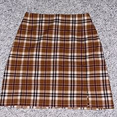 Brandy Melville - Brown And White Plaid Skirt - Never Worn! Let Me Know If You Have Any Questions Brandy Melville Midi Skirt, Ciara Skirt Brandy Melville, Brandy Melville Dana Buckle Skirt, Brandy Melville Mini Skirt, Brandy Melville Cara Skirt, White Plaid Skirt, Brandy Melville Skirt, Brandy Melville Skirts, Tan Plaid