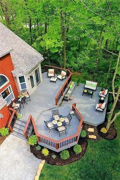 an aerial view of a deck and patio in the woods