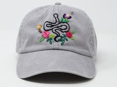 Bee and flower is 100% hand embroidered on a 100% cotton baseball cap. Hat is one size fits all with adjustable back strap. Unique cap, be happy! I am also open for customization. If you want the item in different colors, please message me, it will take additional 2-3 days of handling time. Free first class shipping, upgradable priority mail service. 30 days return policy, feel confident at your purchase! Spring Adjustable Snapback Hat With Curved Visor, Spring Snapback Hat With Embroidered Patch, Embroidered Adjustable Snapback Fitted Hat, Embroidered Adjustable Fitted Hat With Flat Brim, Adjustable Dad Hat With Embroidered Patch, Adjustable Embroidered Snapback Fitted Hat, Adjustable Flat Brim Dad Hat For Spring, Adjustable Dad Hat With Flat Brim For Spring, Spring Adjustable Snapback Hat With Embroidered Logo