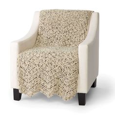 a white chair with a crocheted cover on it's arm and legs