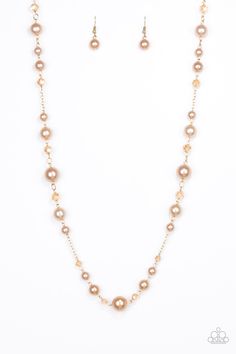 Varying in size, glittery crystal-like beads and pearly golden beads trickle along a shimmery gold chain for a refined look. Features an adjustable clasp closure. Sold as one individual necklace. Includes one pair of matching earrings. Pearl Beaded Necklaces With Chain For Party, Pearl Beaded Necklace With Chain For Parties, Party Pearl Beaded Chain Necklace, Party Gold-tone Necklace With Gold Beads, Party Gold Jewelry With Pearl Chain, Gold Pearl Necklace With Adjustable Chain For Party, Gold Pearl Chain Jewelry For Party, Pearl Beaded Chain Necklace For Party, Party Rose Gold Necklace With Pearl Chain