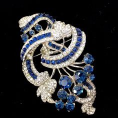 Vintage Staret rhodium plated floral spray sapphire blue crystals brooch pin | eBay Elegant Silver Sapphire Brooches, Blue Sapphire Brooch For Gift, Blue Sapphire Brooches As Gift, Blue Sapphire Brooches For Gift, Fine Jewelry Blue Brooches For Anniversary, Blue Fine Jewelry Brooches For Anniversary, Elegant Sapphire Brooches For Formal Occasions, Elegant Sapphire Brooch Jewelry, Blue Costume Jewelry Brooch For Wedding