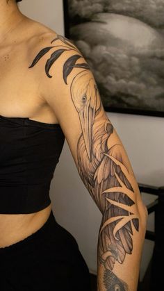 a woman with a tattoo on her arm