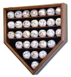 a baseball display case filled with signed baseballs