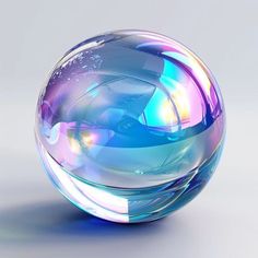 a blue and purple glass ball sitting on top of a table