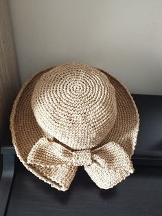 Enhance your wardrobe with our Handcrafted Crochet Straw Hat. This elegant accessory blends sturdy straw with delicate crochet details, creating a unique and refined look. Perfect for sunny days, beach outings, or casual brunches, it offers both style and sun protection. Add a touch of handmade charm to your ensemble with this sophisticated and versatile hat! Bohemian Natural Straw Hat For Garden Party, Adjustable Jute Crochet Hat For Spring, Brimmed Yarn Hats For Vacation, Woven Straw Crochet Fedora Hat, Woven Straw Fedora Crochet Hat, Cream Straw Hat With Woven Details, Vacation Hat With Curved Brim, Cream Woven Straw Hat, Straw Crochet Fedora Hat With Woven Details