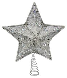 a decorative silver star ornament on a white background