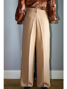 FEATURES Elegant, Classy & Chic High Waisted Wide Leg Pants The wide-leg trouser is a flattering and chic silhouette designed to flatter your shape. Adding a front pleat and pockets, these trousers have a relaxed but tailored construction. Button/zip fly closure with front button, zipper fly, and belt loops. FABRIC 78% Polyester, 18% Rayon, and 4% Spandex Imported SIZE + FIT Sizing is True to Size | Tapered Fit with minimal stretch Size Bust Waist Hip Small (2-4) 36” - 37” 27” – 28” 36” – 37 Classic Full Length Non-stretch Pants, Semi-formal Stretch Bottoms For Spring, Spring Semi-formal Stretch Bottoms, Fitted Tapered Leg Office Bottoms, Fitted Tapered Leg Bottoms For Office, Semi-formal Solid Tapered Leg Bottoms, Solid Color Tapered Leg Bottoms For Semi-formal Events, Solid Tapered Leg Bottoms For Semi-formal Occasions, Beige Wide Leg Bottoms For Evening