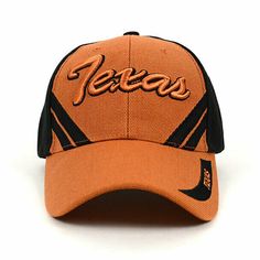 an orange and black baseball cap with the word texas printed on it's front