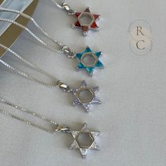 Discover the elegance of this silver Magen David necklace adorned with colored stones. A symbol of protection and spirituality, this exquisite Star of David pendant will captivate all eyes. From purple, crystal clear to deep orange, this pendant accurately represents the Star of David. You will love wearing it with a fresh outfit for any occasion. Lastly, it makes a perfect gift to give or indulge yourself. ADDITIONAL DETAILS D E T A I L S: * MATERIAL: 925 Sterling Silver * PENDANT SIZE: 15mm x Silver Star Of David Necklace With Gemstone, Silver Star Of David Birthstone Jewelry, Silver Star Of David Jewelry With Birthstone, White Gold Star Of David Spiritual Jewelry, Spiritual White Gold Star Of David Jewelry, Spiritual Star Of David White Gold Jewelry, Silver Star Of David Necklace For Hanukkah, Silver Star Of David Necklace For Gift, Hanukkah Sterling Silver Silver Necklace