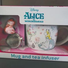 a coffee mug and tea strainer in a box