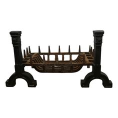 an iron and wood bench with two legs