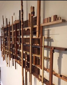 wooden shelves are lined up against the wall