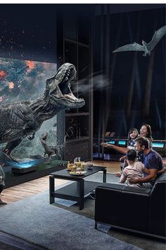 people sitting on couches watching an interactive dinosaur