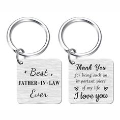 two key chains with the words, best father in law and i love you