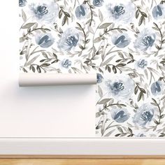 the wall paper has blue flowers on it