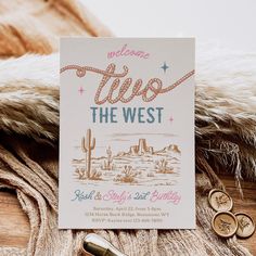 a card with the words welcome two the west on it next to some gold coins