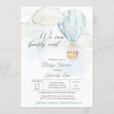 a baby shower with a hot air balloon in the sky