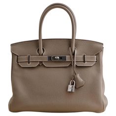 SKU CT-2618 Comes With Hermès Dust Bag, Keys, Padlock, Clochette Date Circa 2017 Model Birkin 30 Serial Number AMM483 IZ Metal Platinum Weight Approximately 1700 g Condition Excellent Other Info Approximately: 30cm x 22cm x 16cm _________________________________________________ If you are interested in any of our previously sold pieces, please contact us and we will do our best to source another one. Birkin 30 Etoupe, Hermes Lindy 26, Hermes Lindy, Horse Motif, Birkin 30, Hermes Birkin 30, Modernist Jewelry, Togo Leather, Kelly Bag