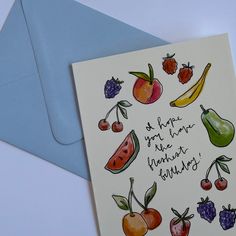 a birthday card with fruit and berries on it