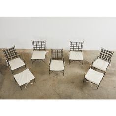 Rare set of seven Italian iron patio and garden lounge chairs and ottomans designed by Mario Papperzini for John Salterini. The Mid-Century Modern garden suite consists of three armchairs with adjustable reclining backs, two non-reclining back side chairs and two ottomans. One ottoman has tall gilt finials, the other does not. The tall ottoman with finials can also be used as a side drinks table by adding a pane of glass to the top. The iconic chairs have the classic woven lattice inset seats an Tall Ottoman, Mid Century Modern Garden, Garden Lounge Chairs, Chairs And Ottomans, Drinks Table, Garden Lounge, Iconic Chairs, Garden Suite, Ottoman Design